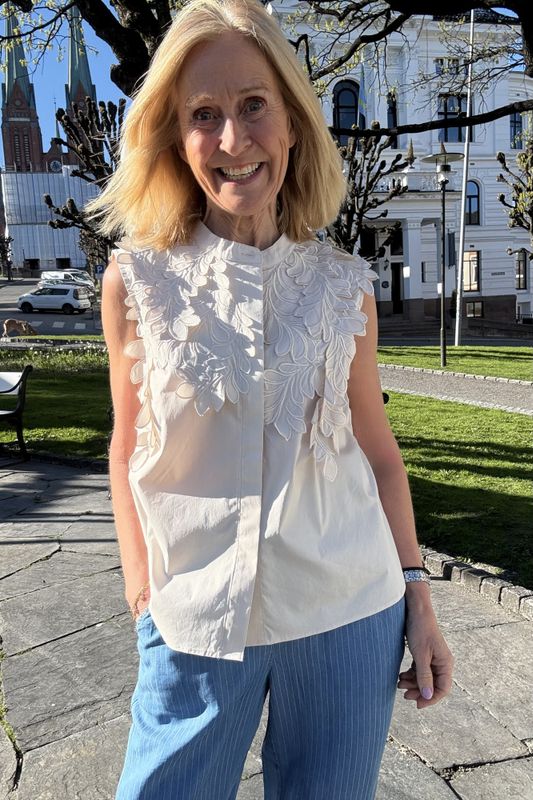 Noen bluse uten arm